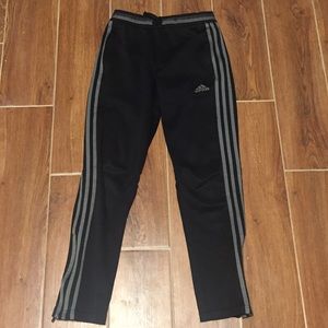 Adidas grey on black track pants.